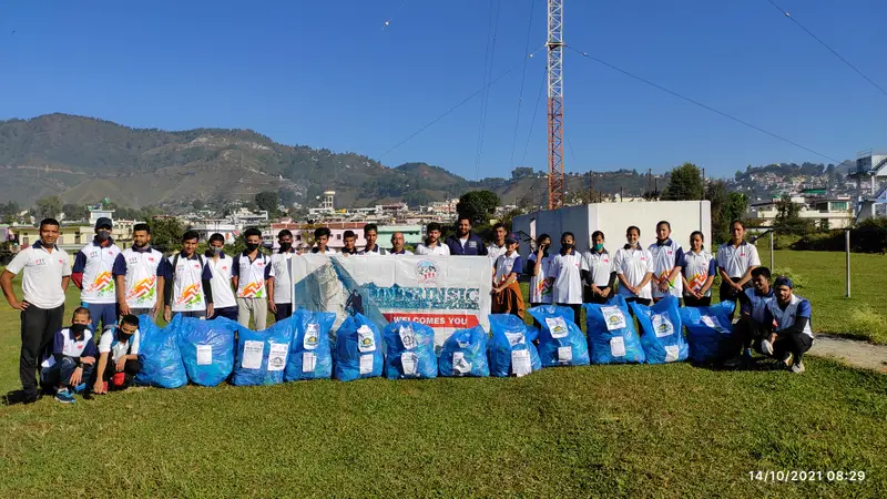 Volunteers with collected waste bags after a clean-up expedition